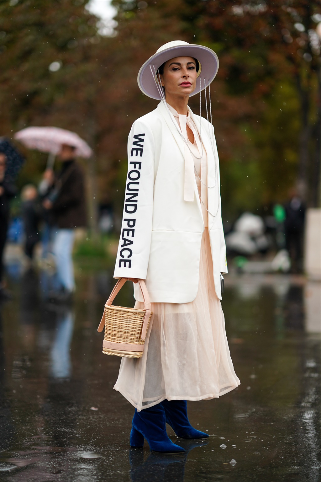 PARIS, FRANCE - OCTOBER 01: A guest wears a white 