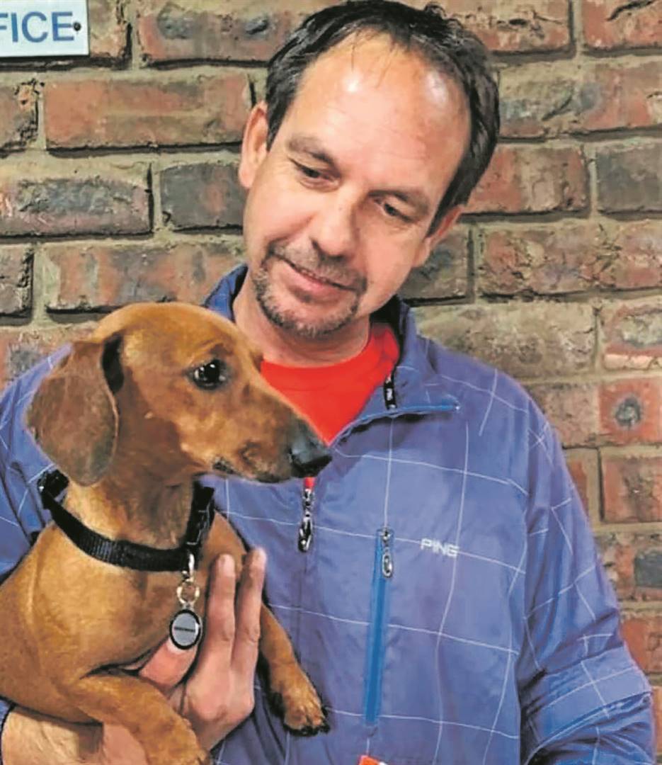Marco Terblanche with one of his two dogs who died in the car.