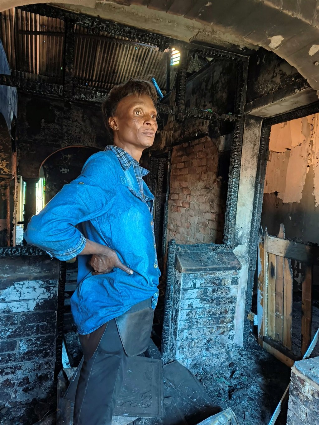 Kholiwe Feni who managed to escape the Brixton house fire. Photo by Mfundekelwa Mkhulisi