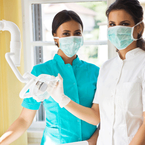 Dental assistant with a dentist 