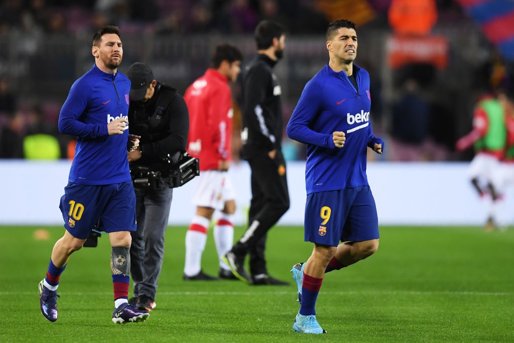 BARCELONA, SPAIN - DECEMBER 07: Lionel Messi (L) and Luis Suarez of FC Barcelona warm up prior to the Liga match between FC Barcelona and RCD Mallorca at Camp Nou on December 07, 2019 in Barcelona, Spain. (Photo by Alex Caparros/Getty Images)