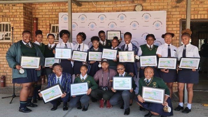 Leondale Secondary School teacher Thando Mdlalo (center) with pupils who are World Changers Candidate ambassadors.