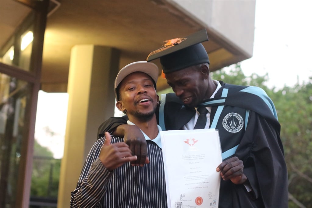 Former homeless graduate Gibson Nzimande celebrates completing his Master's degree. 