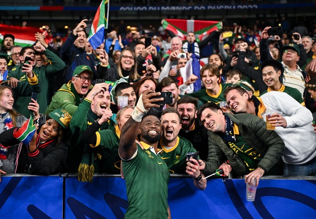 South Africa captain Siya Kolisi celebrates with supporters.