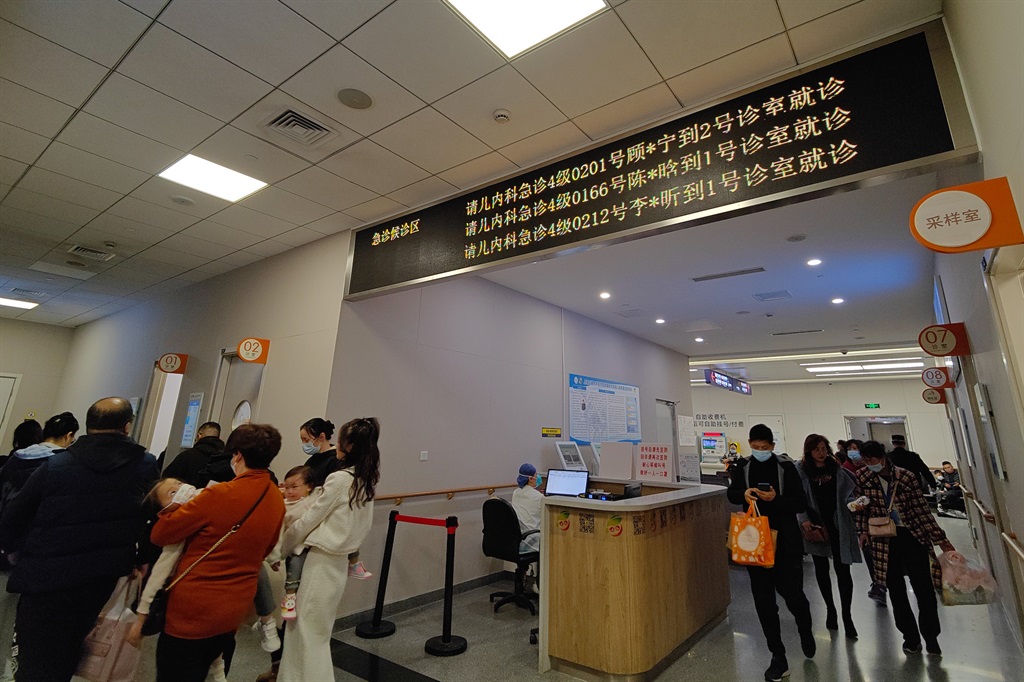 Parents and children at the paediatric emergency department of a hospital in Shanghai, China, on 14 November 2023. (Photo by Costfoto/NurPhoto via Getty Images)