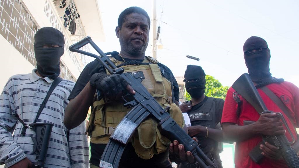 Armed gang leader Jimmy 'Barbecue' Cherizier and his men are seen in Port-au-Prince, Haiti. The gangs say they want to overthrow the disputed prime minister, Ariel Henry, who was out of the country at the weekend for a trip to Kenya. (Clarens Siffroy/AFP)