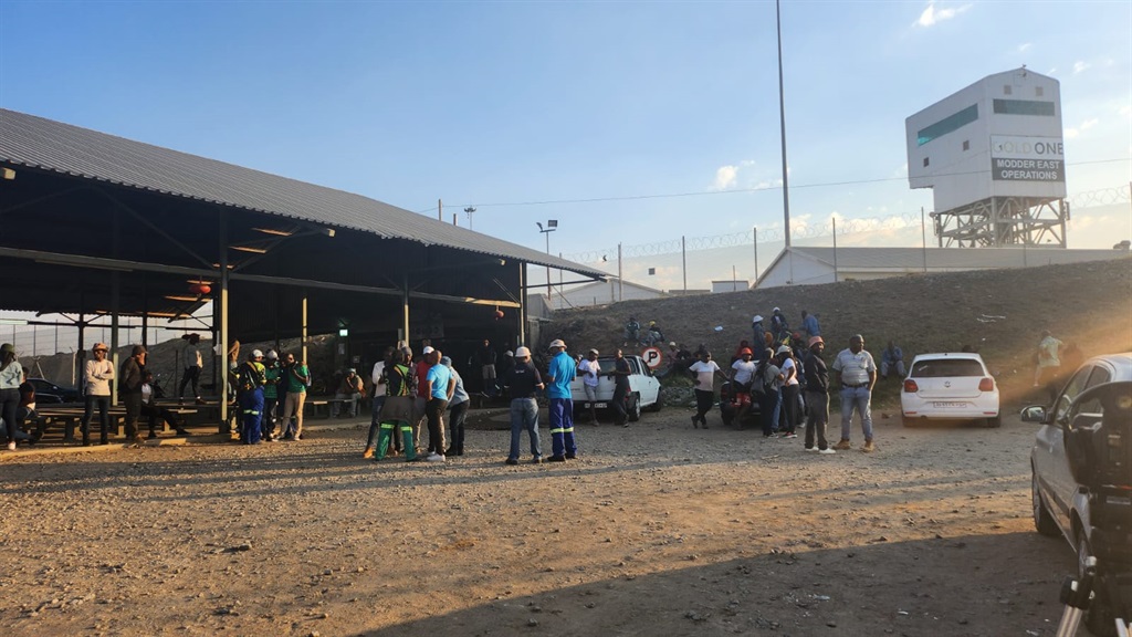 A woman who was among scores of Gold One mineworkers allegedly held hostage underground at the Gold One Modder East Operations in Springs claimed she feared for her life as days went by.  