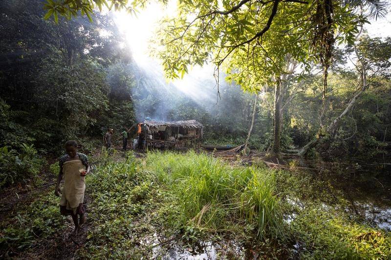 Hunters stand in a camp in the forest an eight hour paddle from the city of Mbandaka in Democratic Republic of the Congo. New technology is helping to save the destruction of the world’s forests. Picture: Reuters