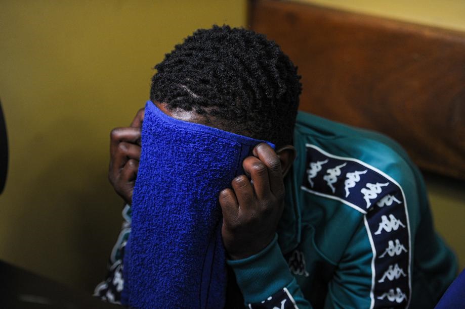 Karabo Bahurutshe trying to hide his face from the media. Picture: Rosetta Msimango