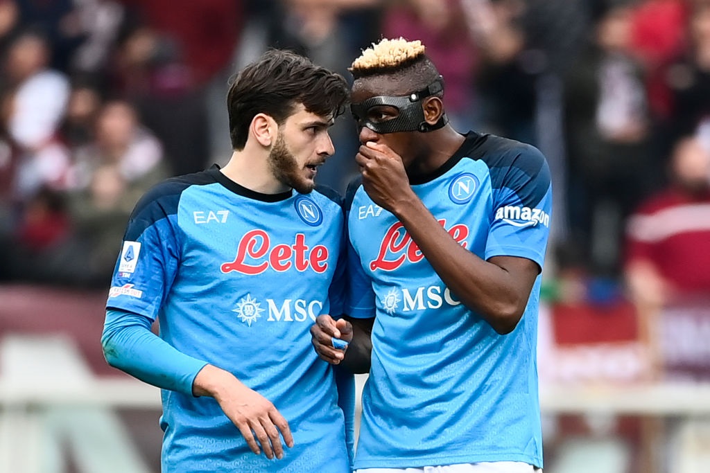 TURIN, ITALY - MARCH 19: (L-R) Khvicha Kvaratskhelia of SSC Napoli and Victor Osimhen of SSC Napoli speaks during the Serie A match between Torino FC and SSC Napoli at Stadio Olimpico di Torino on March 19, 2023 in Turin, Italy. (Photo by Stefano Guidi/Getty Images)