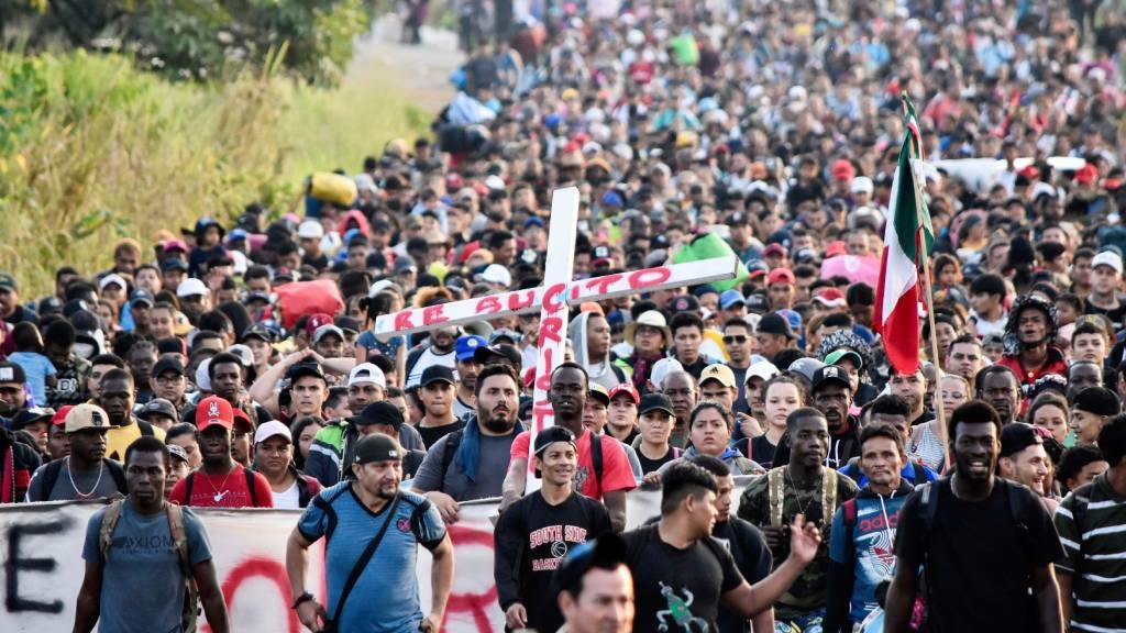 Migrants take part in a caravan toward the border 