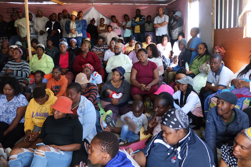 Residents from Social Distance informal settlement held a meeting at a church after their shack was demolished. Photo by Lulekwa Mbadamane