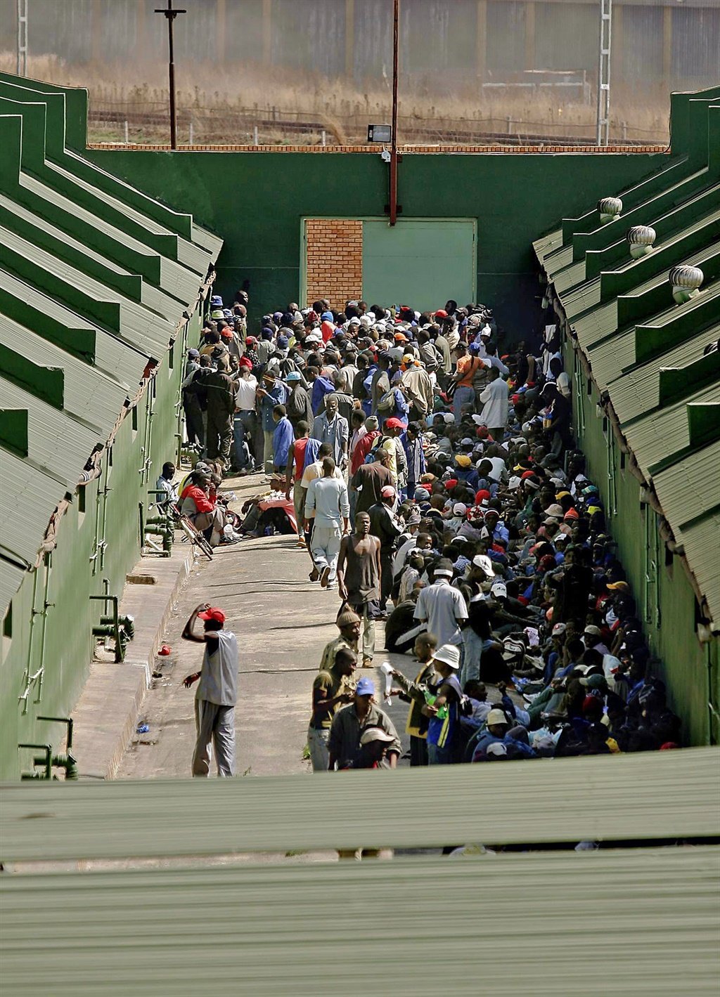 Hundreds of detained men on the other side of the repatriation tunnel at the Lindela Repatriation Centre in Krugersdorp, South Africa. (Photograph by Lisa Skinner/Gallo Images)