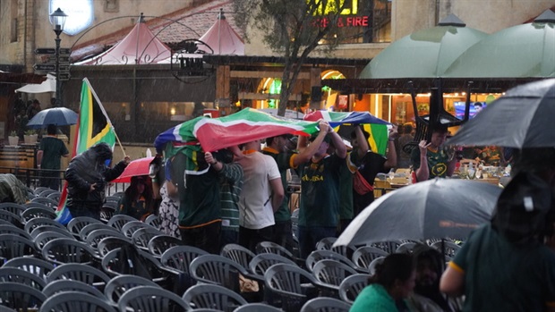 <em>Rugby fans taking cover at Montecasino because of the heavy rains ... (Alfonso Nqunjana/News24)</em>
