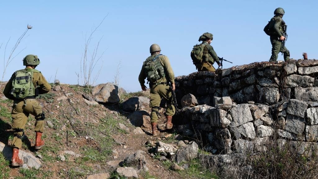 Israeli soldiers man a position in the Israel-annexed Golan Heights near the border with Syria.