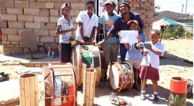 Moeketsi Phejane (third from right) teaches kids to work with their hands. Photo by  Nobathembu Zibi
