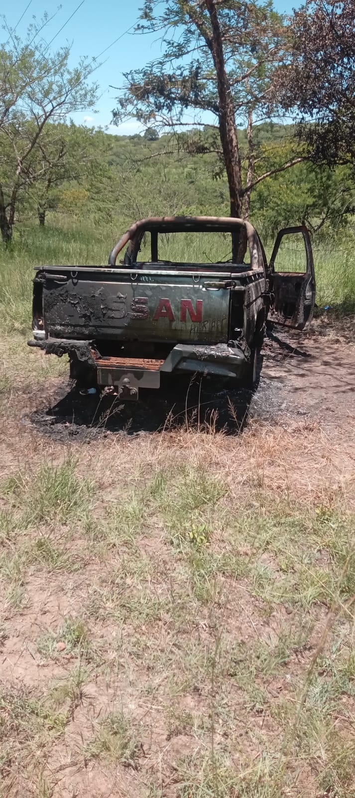 The burnt Nissan bakkie in which the suspected cow thieves were found.