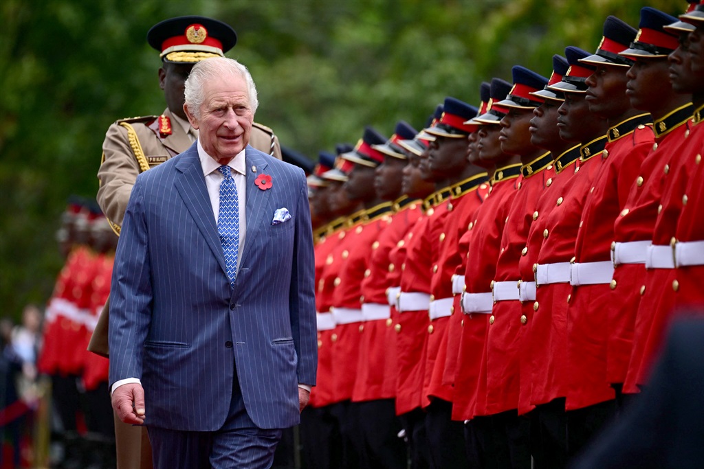 Britain's King Charles III inspects the Guard of Honour as he arrives for the ceremonial welcome at the State House in Nairobi. 