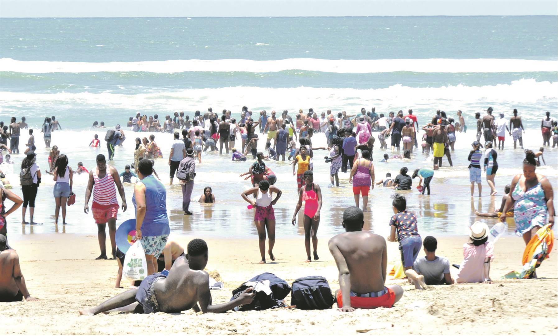 Thousands of people enjoy their time at Durban’s North Beach on Monday.         Photo by                                                                                   Jabulani Langa