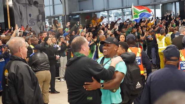 <em>Springbok hooker Bongi Mbonambi celebrates with fans at OR Tambo International Airport. (Pictures: Alfonso Nqunjana/News24)</em>