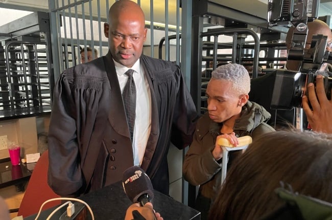 Matthew Lani and his lawyer, Dumisani Mabunda, at the Johannesburg Magistrates' Court, when his charges were withdrawn.