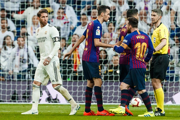 Sergio Ramos of Real Madrid and Lionel Messi of Barcelona gestures during the La Liga match between Real Madrid CF and FC Barcelona at Estadio Santiago Bernabeu on March 2, 2019 in Madrid, Spain.
