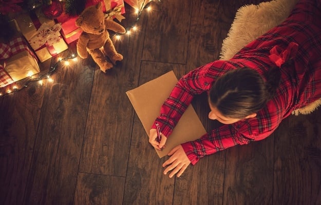Girl writes letter to Santa. (PHOTO: Getty/Gallo Images)