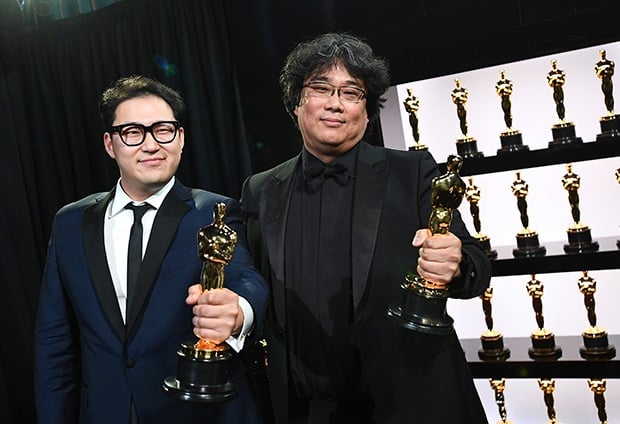 Best Original Screenplay award winners Han Jin Won and Bong Joon Ho pose backstage during the 92nd Annual Academy Awards.
