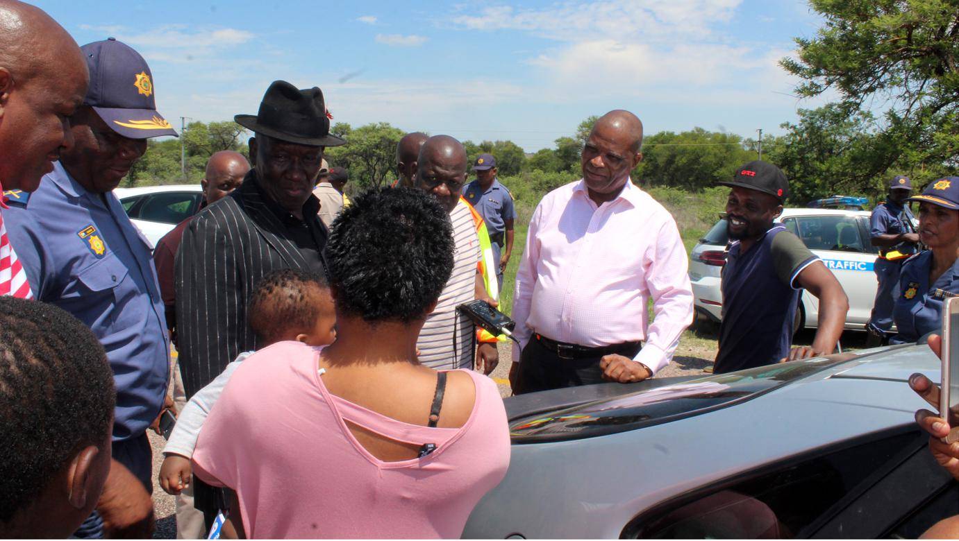 Police Minister General Bheki Cele (third from left, back) talks to residents and cops in Polokwane, Limpopo, yesterday.                      Photo by Phuti Raletjena