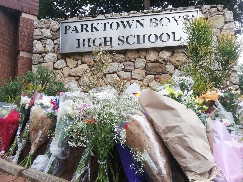 Flowers are laid at the entrance of Parktown Boys' High School.