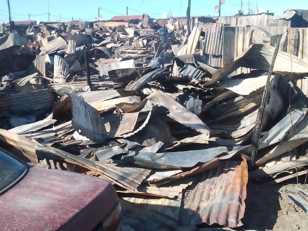 A devastating fire consumed over 152 structures and claimed the lives of two adults. Photo by Lulekwa Mbadamane