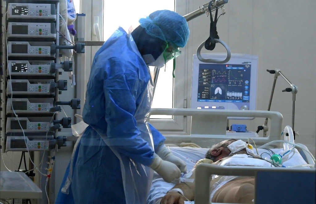 A doctor attends to a Covid-19 patient at the intensive care unit of the Ariana Mami hospital in the city of Ariana near the Tunisian capital Tunis on 22 April 2020, during the novel coronavirus pandemic crisis.