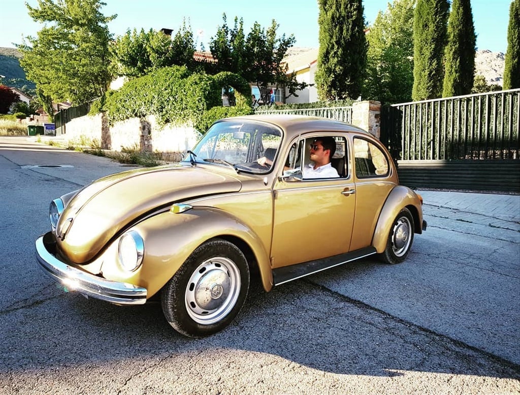 Aitor van den Brule in classic Volkswagen Beetle.