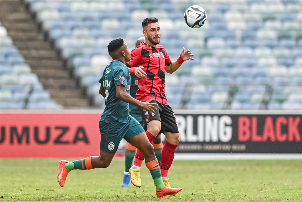 DURBAN, SOUTH AFRICA - DECEMBER 03: Higor Vidal of TS Galaxy FC and Henrick Ekstein of AmaZulu FC during the Carling Knockout, semi-final match between AmaZulu FC and TS Galaxy FC at Moses Mabhida Stadium on December 03, 2023 in Durban, South Africa. (Photo by Darren Stewart/Gallo Images)
