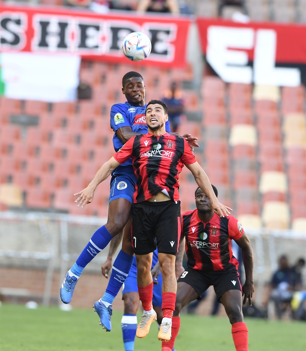POLOKWANE, SOUTH AFRICA - DECEMBER 03: Ime Okon of SuperSport United and Abdelfatech Belkacemi of  USMA during the CAF Confederation Cup match between SuperSport United and USMA at Peter Mokaba Stadium on December 03, 2023 in Polokwane, South Africa. (Photo by Philip Maeta/Gallo Images),É-¨ë