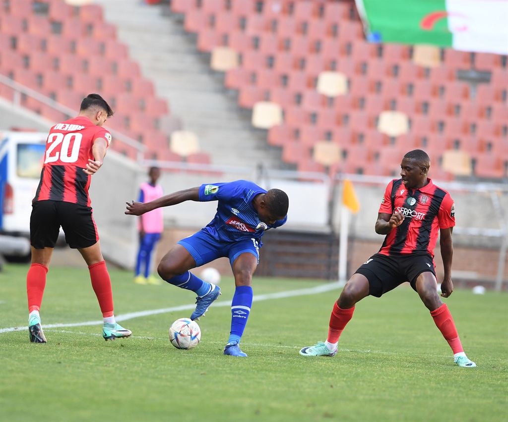 POLOKWANE, SOUTH AFRICA - DECEMBER 03: Ime Okon of SuperSport United and Tumisang Orenboye of USM Alger during the CAF Confederation Cup match between SuperSport United and USMA at Peter Mokaba Stadium on December 03, 2023 in Polokwane, South Africa. (Photo by Philip Maeta/Gallo Images)