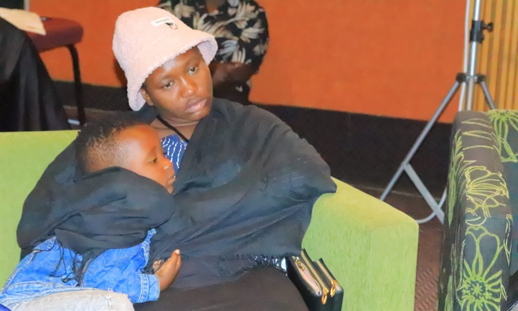 The wife of radio presenter, Tiyani Mabasa, Vanessa Kukeya with their 4-year old son during the memorial service.