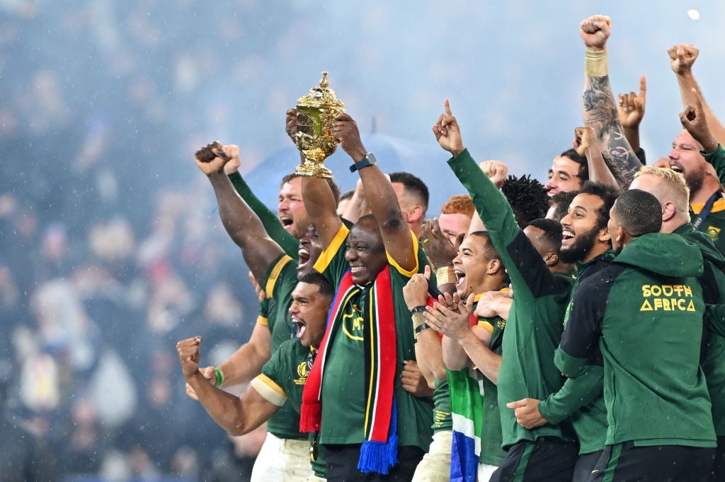 PARIS, FRANCE - OCTOBER 28: Cyril Ramaphosa, President of South Africa, lifts the The Webb Ellis Cup following the Rugby World Cup Final match between New Zealand and South Africa at Stade de France on October 28.  