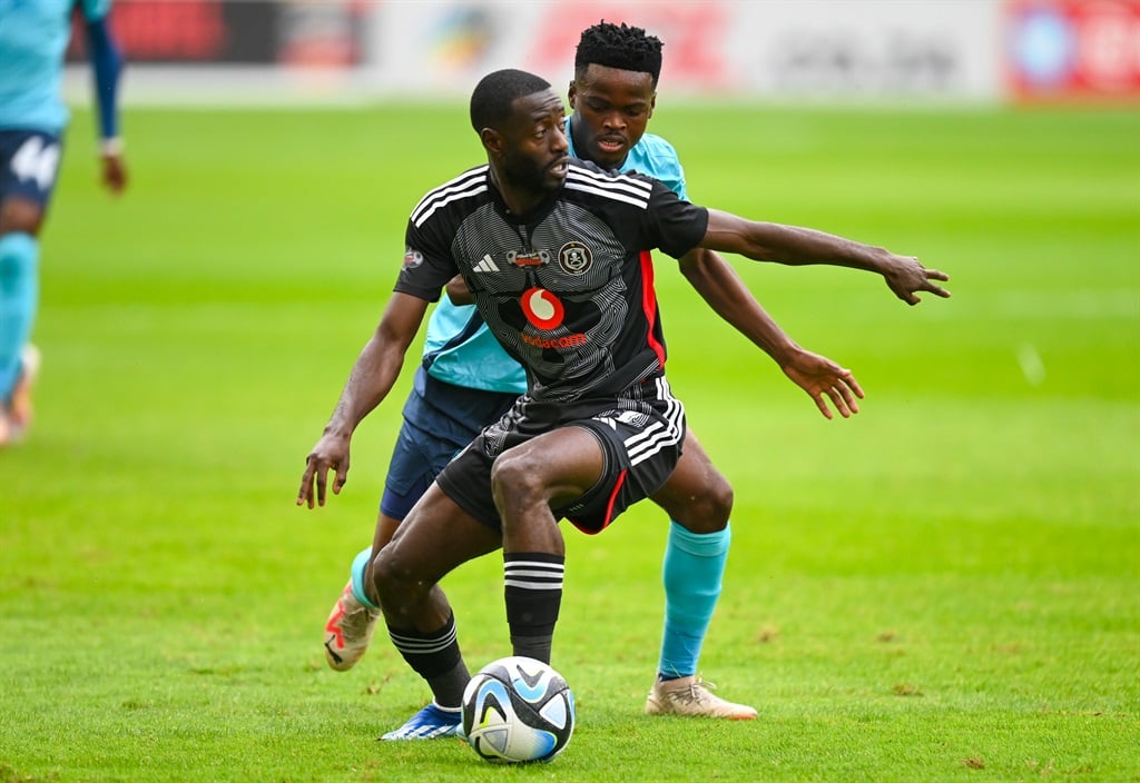 DURBAN, SOUTH AFRICA - NOVEMBER 04: Thulani Gumede of Richards Bay FC challenges Deon Hotto of Orlando Pirates during the Carling Knockout, Quarter Final match between Richards Bay and Orlando Pirates at Moses Mabhida Stadium on November 04, 2023 in Durban, South Africa. (Photo by Gerhard Duraan/Gallo Images)
