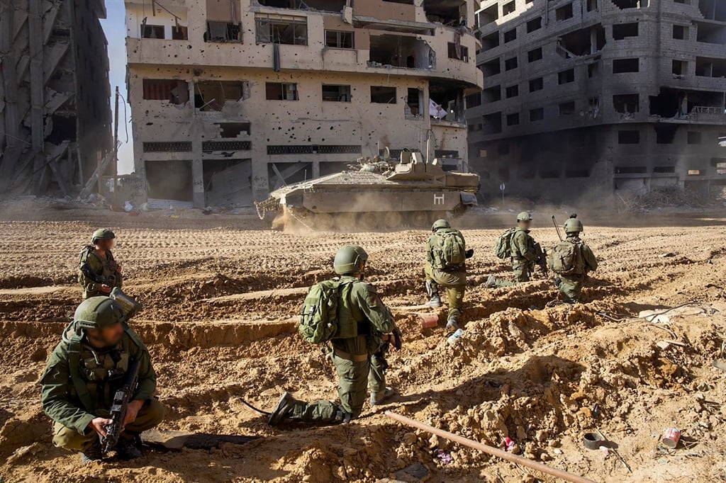 This picture released by the Israeli army shows troops on the ground on the Gaza Strip on 7 December 2023, amid continuing battles between Israel and the Palestinian militant group Hamas. Israeli troops battled Hamas militants on 7 December in the heart of southern Gaza's main city of Khan Yunis where a suspected mastermind of the 7 October attacks is believed to be hiding, while pressing their offensive across the besieged territory. 