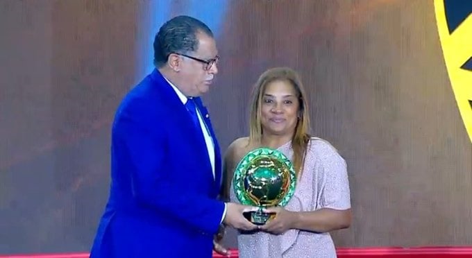 Banyana coach Desiree Ellis receives her CAF award from Safa president Danny Jordaan. Picture: Supplied