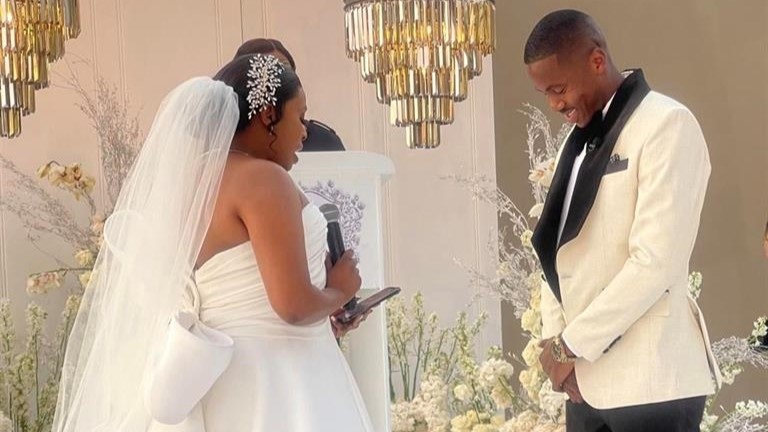 AmaZulu striker Bongi Ntuli and AmaZulu CEO Sinenjabulo Zungu during their white wedding in September 2023. 