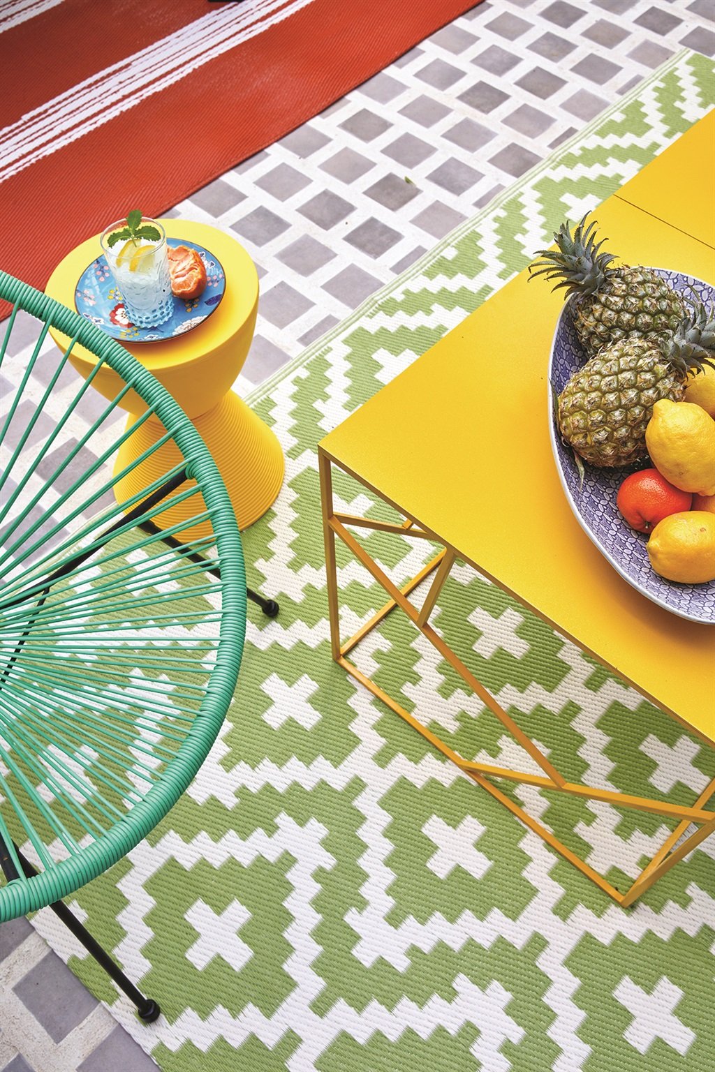Yellow Wire World table available from Mink Design; green Acapulco chair from Chair 
Crazy; rugs from India Ink; side table from Esque; floor tiles from Ceramica.