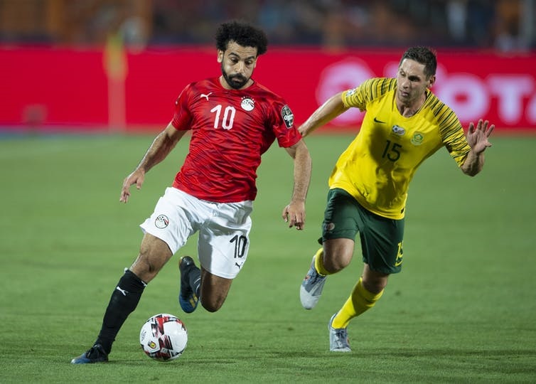 Mohamed Salah of Egypt and Dean Furman of South Africa during the 2019 Africa Cup of Nations tournament. Visionhaus/Getty Images