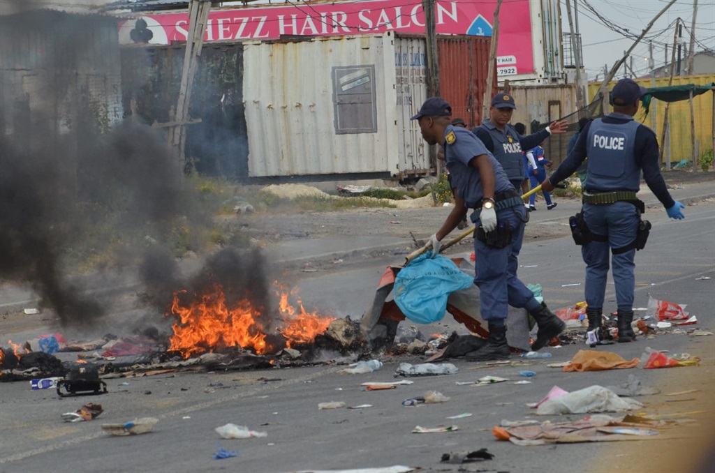 Gatvol residents through rubbish on the streets in