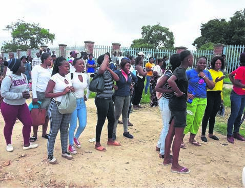 Prospective students stand outside Mapulaneng Campus after former SRC members clashed with residents on Tuesday.