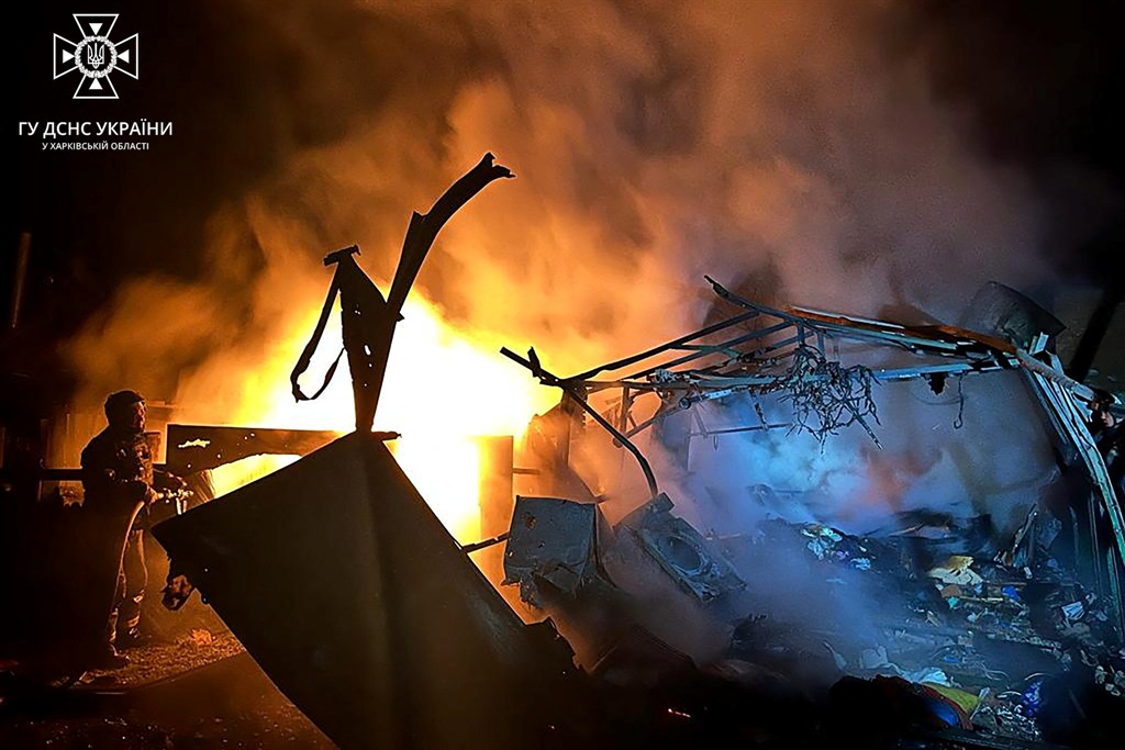 This handout picture by Ukrainian Emergency Service taken late on 9 November 2023 shows a firefighter putting out a fire in destroyed home following Russian strike in Kupiansk, (Photo by Handout / Ukraine Emergency Service / AFP)