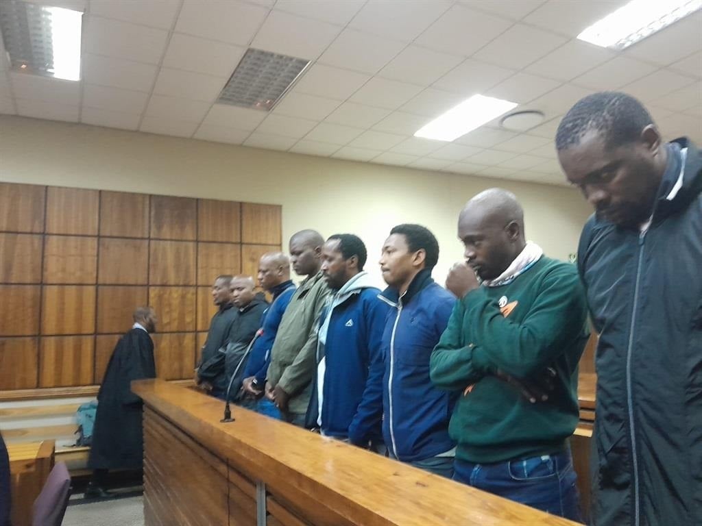 The eight members of Deputy President Paul Mashatile's VIP protection unit appear before the Randburg Magistrates Court (Zandile Khumalo/News24)