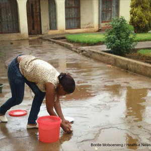 Girl collects rain water
