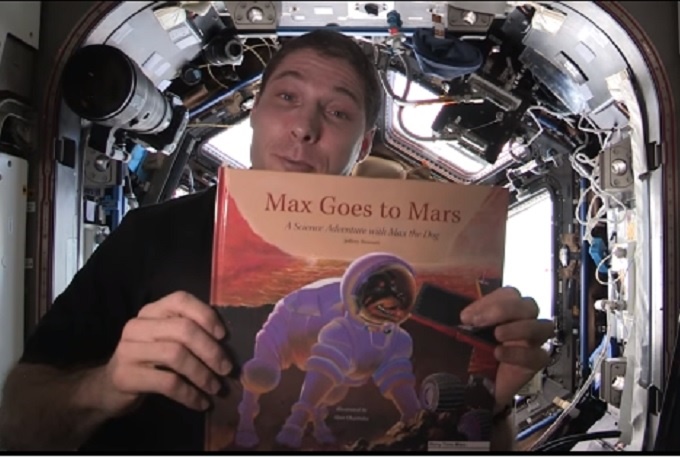 Astronaut Mike Hopkins reading Max Goes to Mars, by Jeffrey Bennet. 